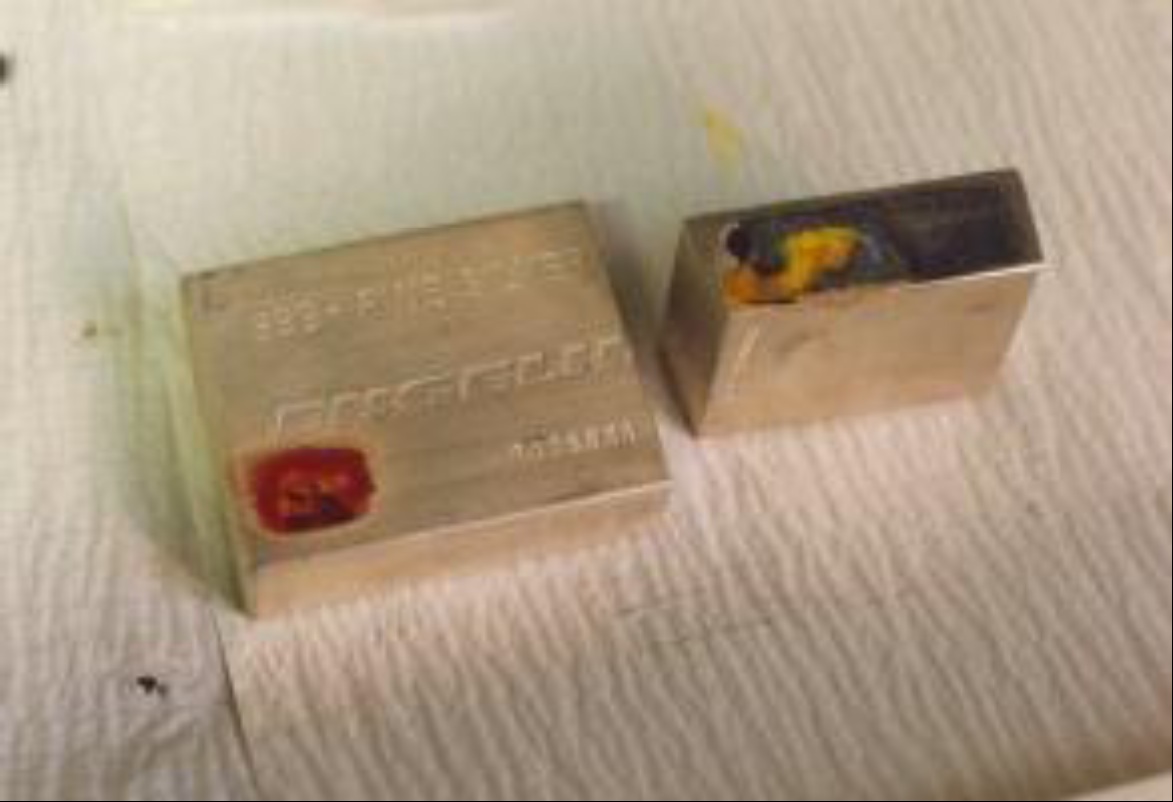 A hollowed-out 100 ounce (oz) Engelhard silver bar, filled with lead, that was cut in half by the FBI.